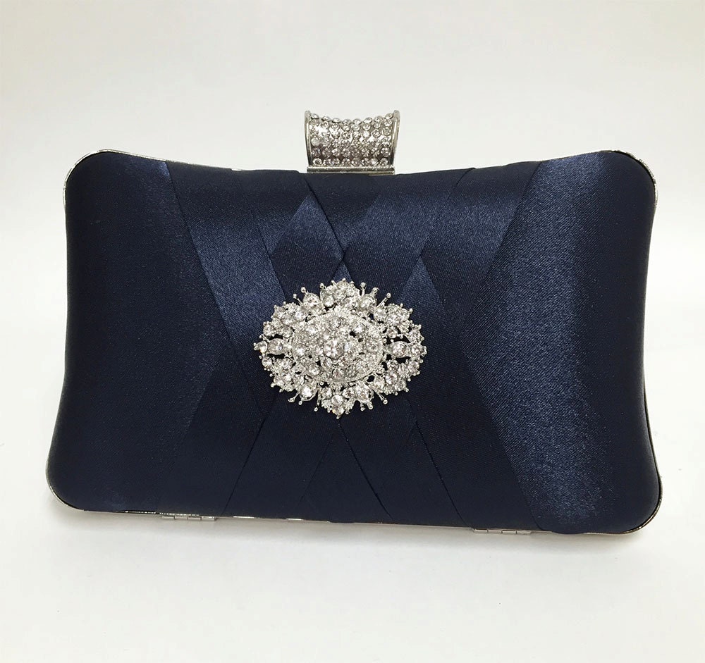 navy blue and white clutch bag