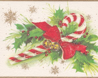 Unused 1960s Christmas card with a candy cane and holly theme