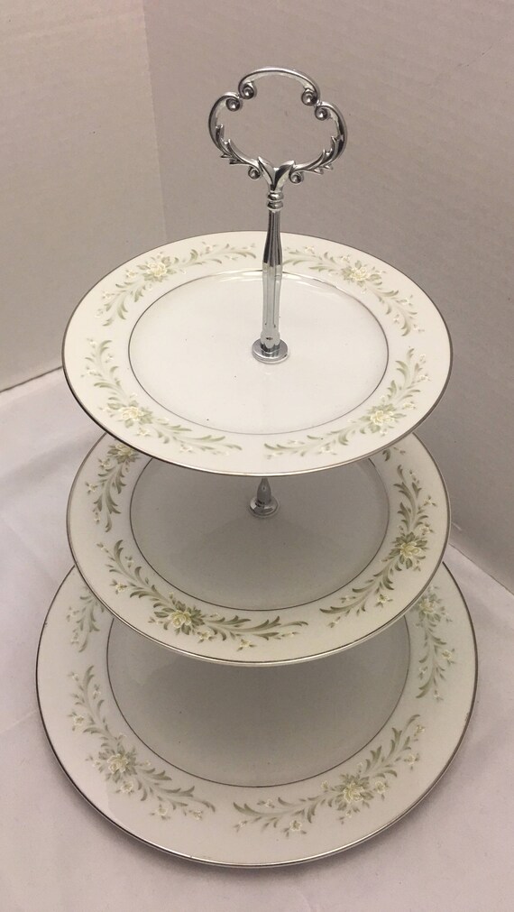 Three tiered china cake plate/ stand. Green and cream flowers