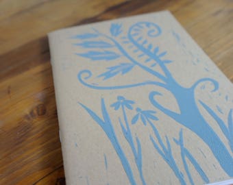 Handprinted flower and tree lino-cut notebook