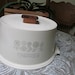 Vtg 1960's Cake Pastry Locking Container Carrier Holder 12 Inches Across by 7 Inches High Says Pastries on Front Cream with Brown Top Knob