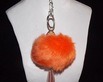 Key tassel representing a character