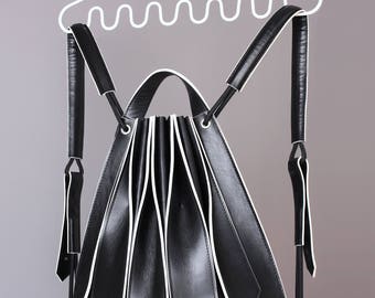 LI black leather backpack with white edgepaint