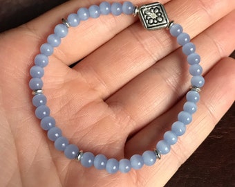 Pale Blue Glass Beaded Bracelet with Silver Stamped Flower