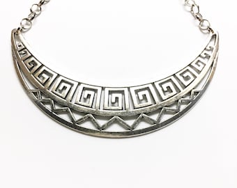 Geometric bib necklace.