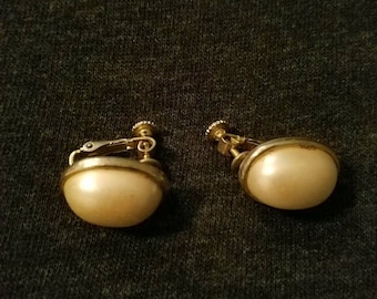 Faux pearl and gold Dauplaise clip on earrings. Signed .