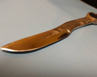 A hand forged knife made from a wrench.