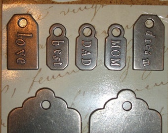 We are family-mom, dad and all the rest....... Set with 7 metal tags/pendant in silver