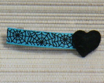 Turquoise bar with spider webs and black heart