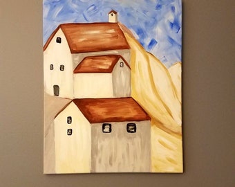 Row of old houses on a hill side.