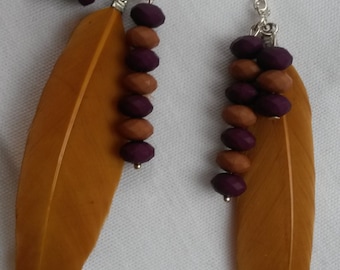 Lovely ochreous feather earrings with a beads, dangling earrings