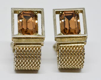 Gold tone cuff links