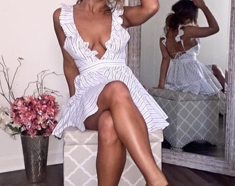 striped ruffle romper with an x shaped back