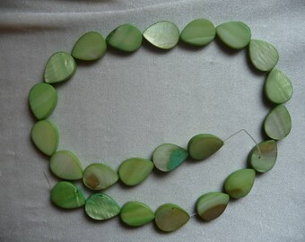 Beads, mother-of-pearl 18x14mm lime green teardrop. Sold per 16 inch strand. There are 23 beads on the strand.