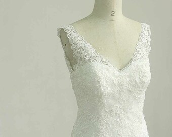 Open back Deep v neckline fit and flare Ivory lace wedding dress