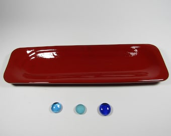 Red ceramic spoon rest fired.
