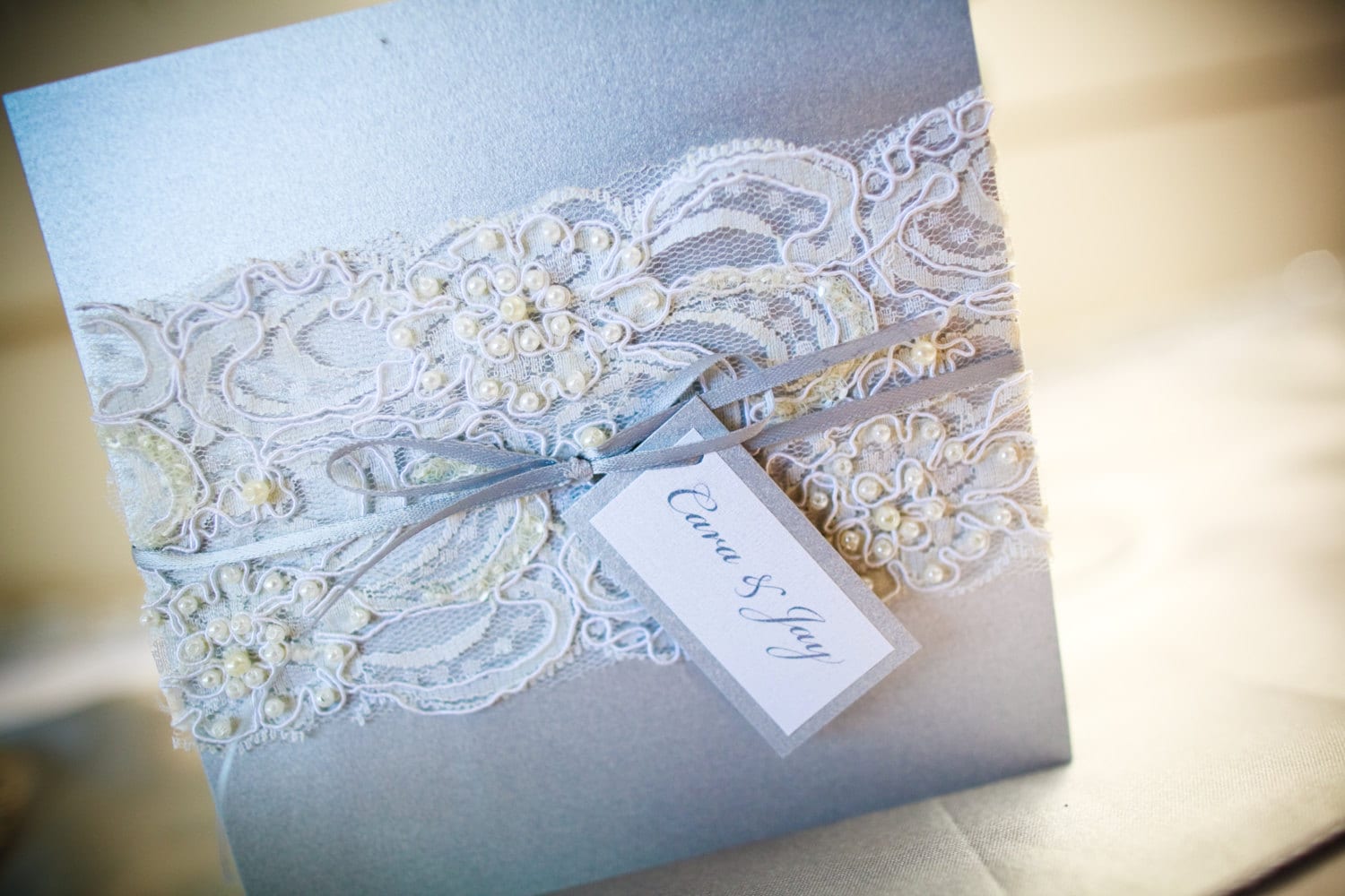 This beaded lace wedding invitation is the perfect addition to a classic