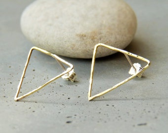 Earrings are made of thin hammered brass triangle studs
