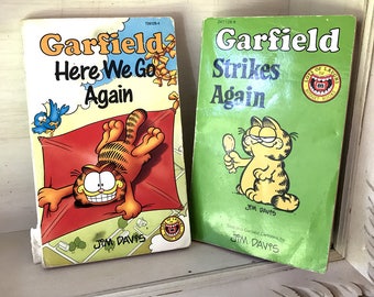 Two vintage Garfield comics 'Here we go again' 1989 and 'Strikes Back' 1985 by Jim Davis