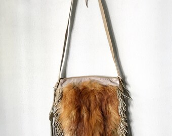 Red fox fur crossbody bags .