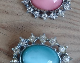 Vintage pink and blue rhinestone brooches