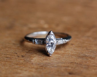 Vintage 1940s marquise diamond 1/2 carat engagement ring with baguette accents