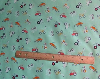 Green with Multicolored Tractors Cotton Fabric by the Yard