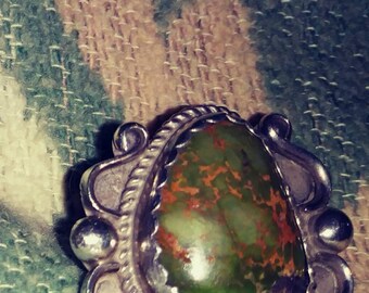 Bold vintage Native American sterling silver turquoise ring.