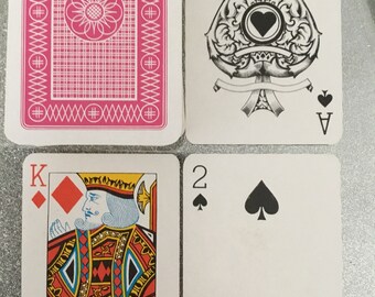 Pink back, Plastic coated playing cards. Plastic boxed.