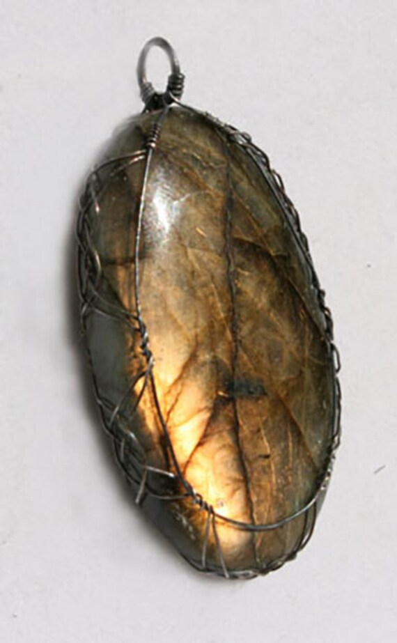Labradorite pendant wrapped Celtic style with sterling silver