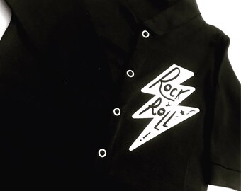 Unisex black baby-grow with white Rock & Roll slogan. Alternative kidswear fun for all mini Punks or Rock Gods.