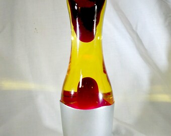 80's Era Rocket-Shaped Lava Lamp w/ Silver-Colored Plastic Resin Base & Cap w/ Red 'Lava' in Yellow Fluid - 16 x 5 x 5