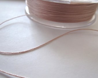 1 meter of 0.38 MM pale pink silk thread