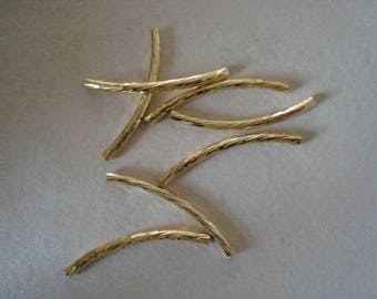 Set of 2 gold colored metal tubes