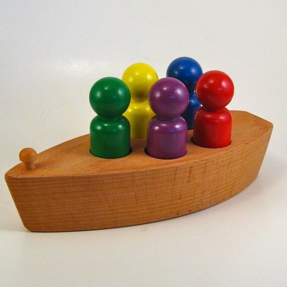 wooden toy boat with wooden toy rainbow peg people