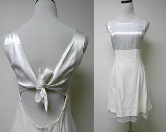 T.W.H. 90s cut-out / tie back . little white dress . size 7 / 8 . made in USA