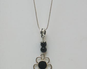 A pretty and delicate... from elegant black pendant