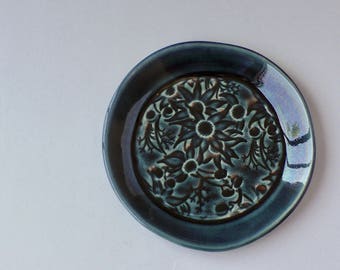Deep blue ceramic plate with Australian Flannel Flowers
