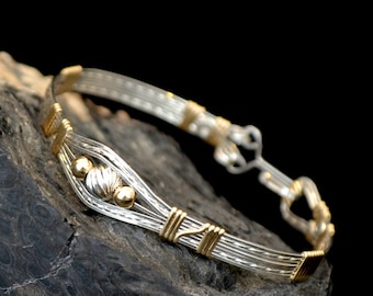Sterling silver and 14K gold filled wire wrapped bracelet. "Ru la la"