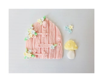 Edible fairy door. Pink wood affect with flower detail and toadstool.