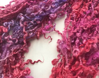 Handspun art yarn - tailspun British Wensleydale locks, handdyed in shades or purples and reds.