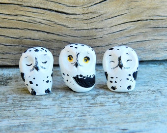 three tiny snowy owl figurines