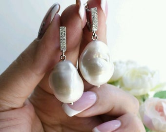 Natural baroque freshwater pearl earings .