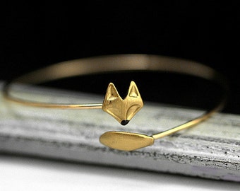 Delicate hand gilded fox bangle. Fox and tail, hand gilded and enameled. Adjustable wrap bangle.