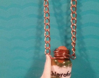 Chloroform bottle and rag necklace