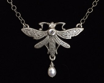 Sterling silver cast dragonfly with freshwater pearl and CZ.