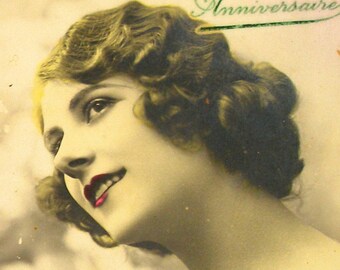 1920s French postcard, Lady with flowers. RPPC, real photo, paper ephemera.