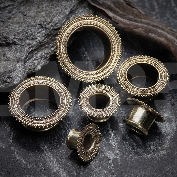 A Pair of Nior Casted Brass Double Flared Eyelet Plug
