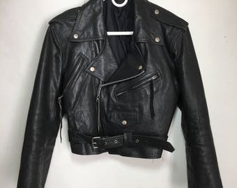 Vintage black leather jacket , motorcycle woman jacket size medium .