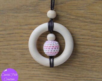 Babywearing necklace with wooden teething ring. 'JUPITER' - (Candyfloss Pink). Fiddle beads, nursing necklace.